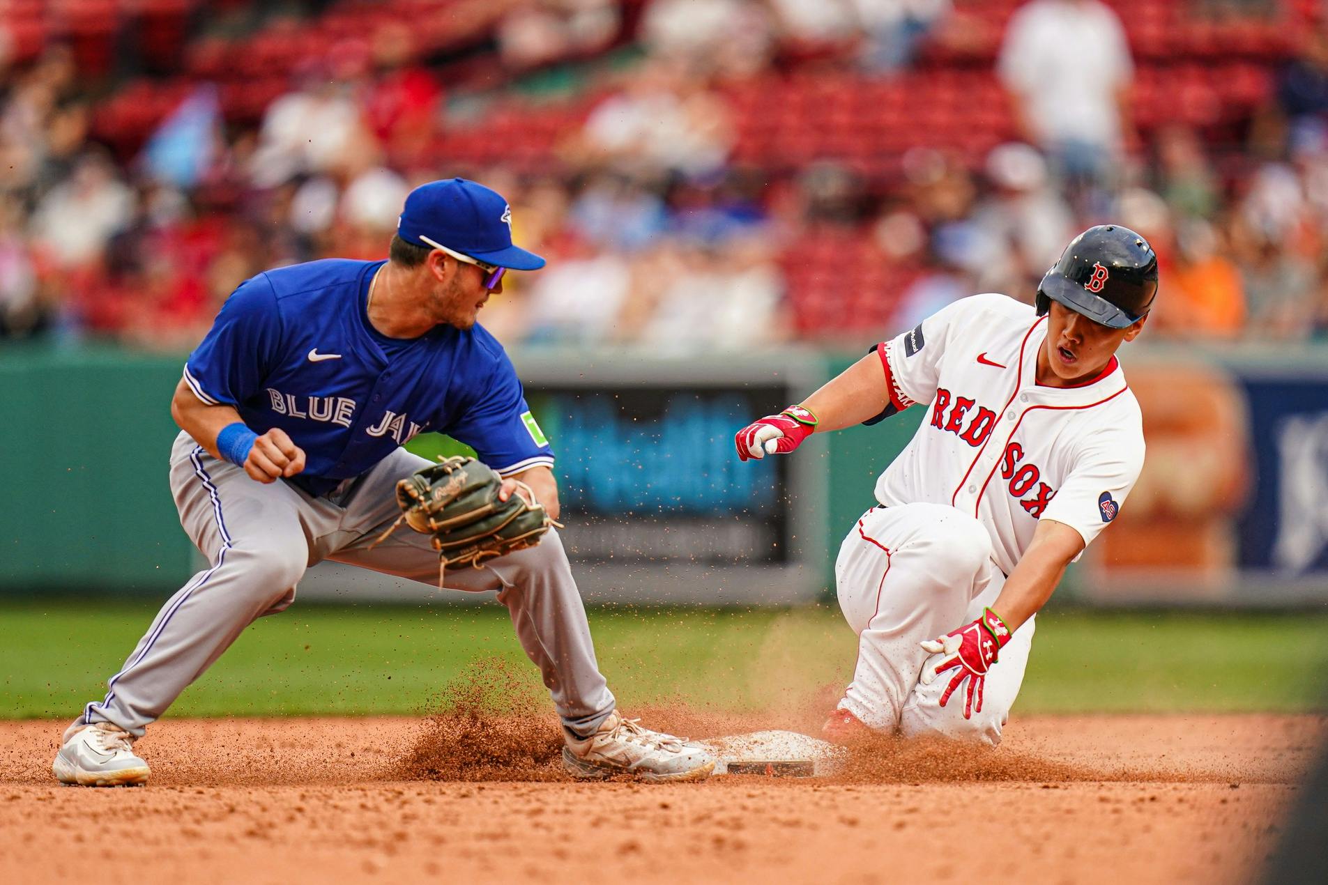 Boston, Massachusetts, USA; Boston Red Sox designated hitter Masataka Yoshida (7) hits a double against the Toronto Blue Jays in the ninth inning at Fenway Park.