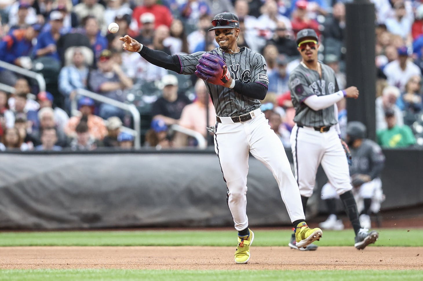 New York Mets shortstop Francisco Lindor (12) throws a runner out at first base in the first inning against the Cincinnati Reds at Citi Field.