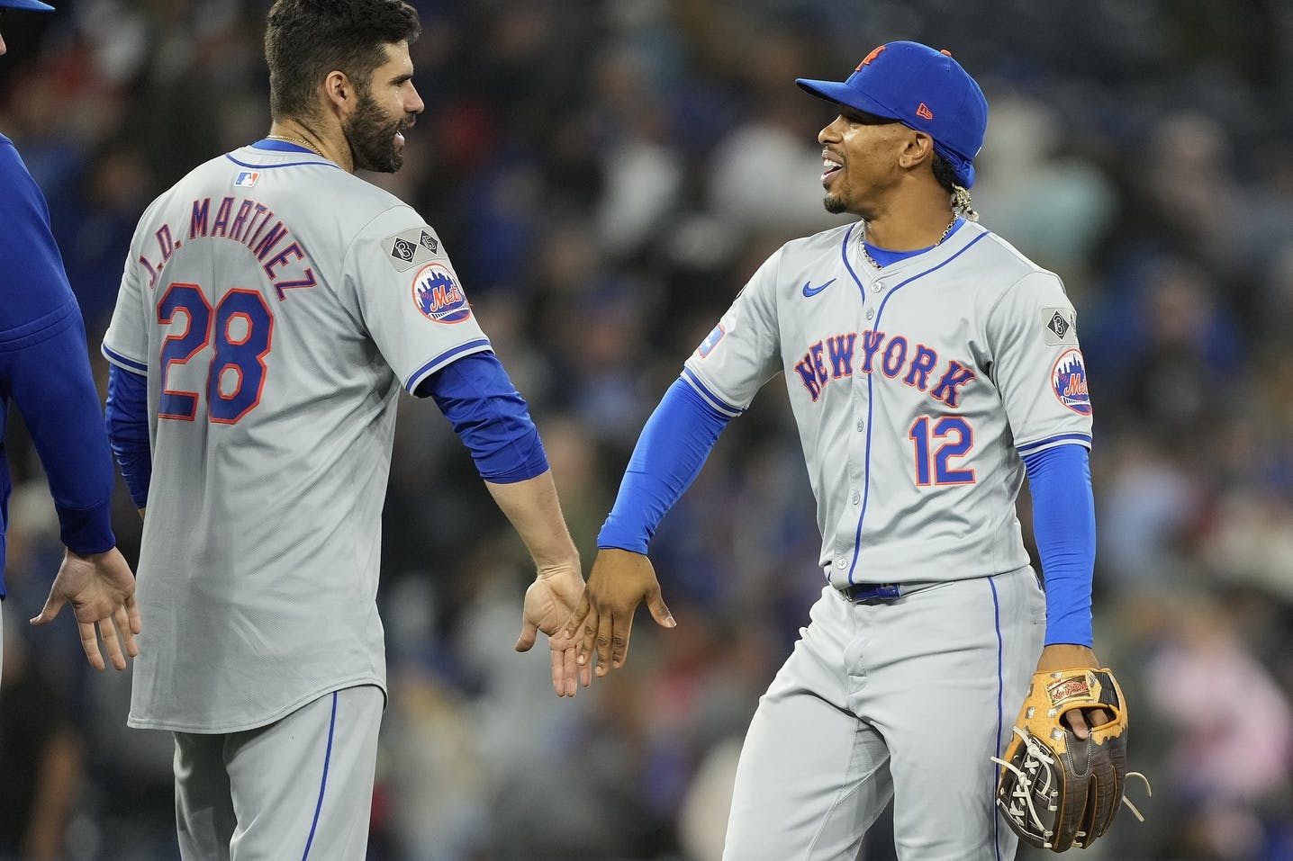 New York Mets designated hitter J.D. Martinez (28) and shortstop Francisco Lindor (12) celebrate a win over the Toronto Blue Jays at Rogers Centre